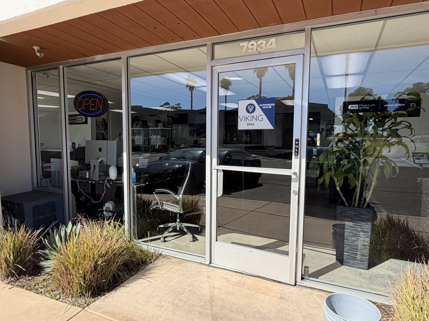 Commercial storefront with crystal-clear glass cleaned by Waves Window Washing